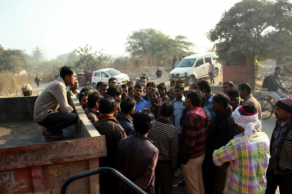 Daily wage workers gather every morning at a particular place, waiting and hoping to be picked by factory contractors for the day.