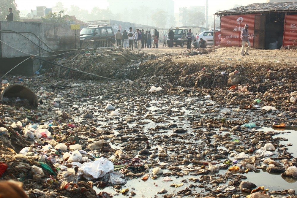 Literally stacked on dumpyards, the workers and their families are exposed to terrible living conditions.