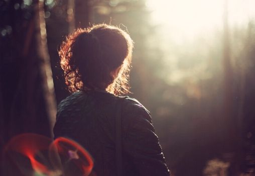woman sitting in nature, park